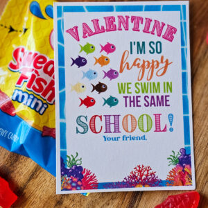 Valentine, I'm so happy we swim in the same school! Colorful card with fish. Swedish Fish candy in the background.