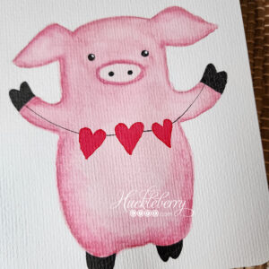 Hand-painted watercolor pink pig standing and holding a banner of red hearts.